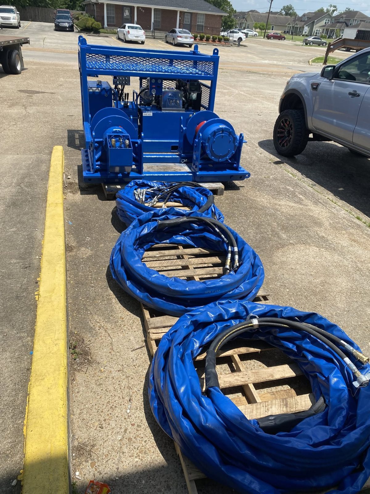 Blue hydraulic spooling unit with hose sets
